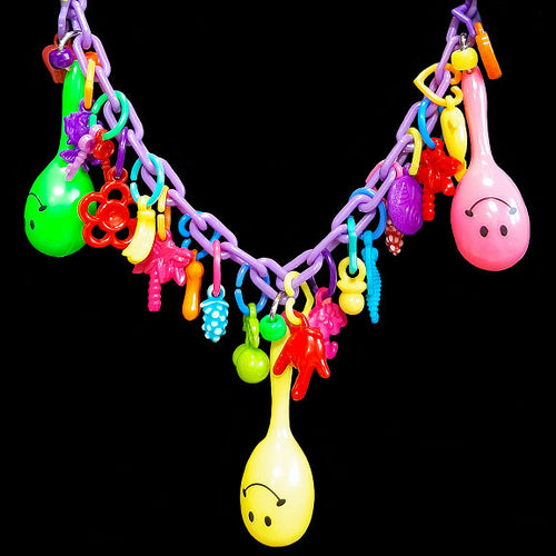 Does your bird love to play with your zipper, buttons or jewelry? If so, both of you will love this necklace made just for them! Designed to be worn around your neck so your bird can play while on you. Made with plastic chain, lots of charms and three min